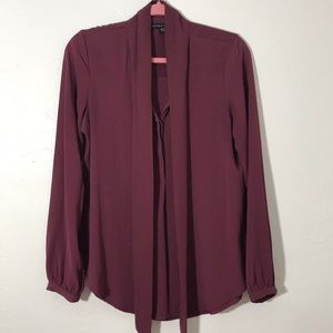Loose fitting burgundy pussy bow blouse
